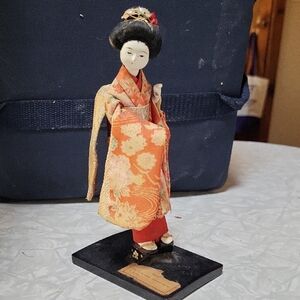 Elegant Japanese Geisha Figurine in Orange Kimono